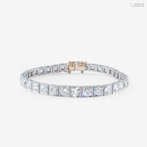 A diamond and platinum line bracelet,