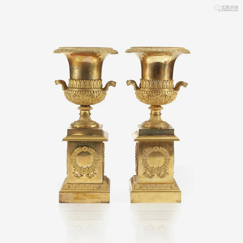 A pair of Charles X ormolu campana urns on pe…