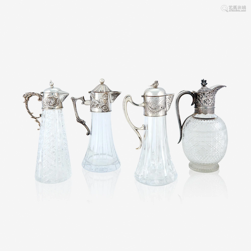 Four silver-mounted cut-glass claret jugs, 19th century