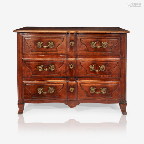 A Régence walnut commode with unusual bird-f…