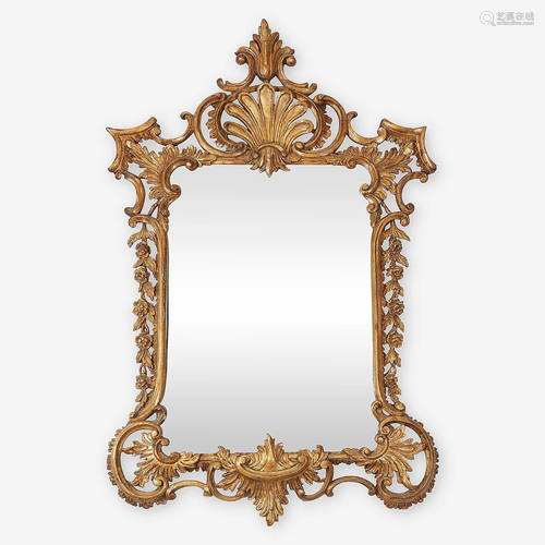 A Continental Rococo carved pine giltwood mirror,