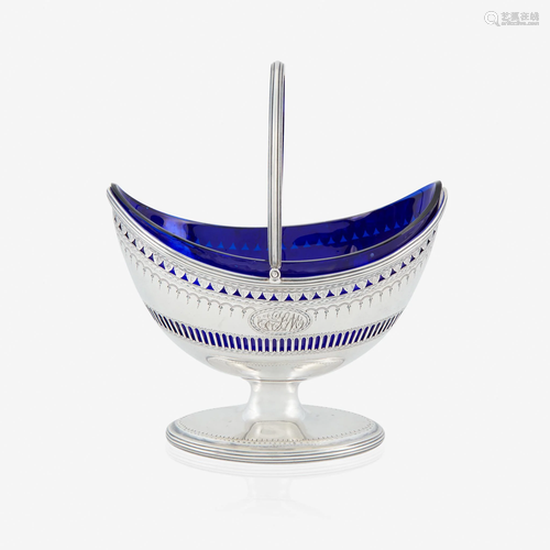 A George III silver sugar basket with cobalt glass