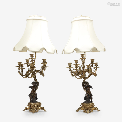 A pair of Louis XV style gilt and patinated bronze