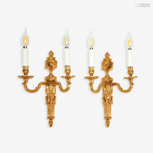 A pair of Louis XVI style gilt-bronze two-light