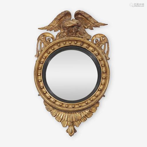 A Regency parcel-ebonized giltwood convex mi…