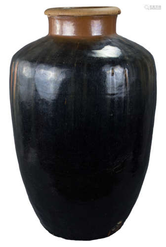 A large Chinese Yuan / Ming Dynasty black glazed pottery storage jar, 80cm tall