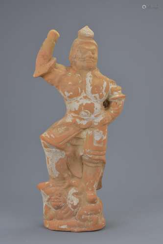 A Chinese Tang Dynasty (618-901) red pottery figure of a Tomb Guardian