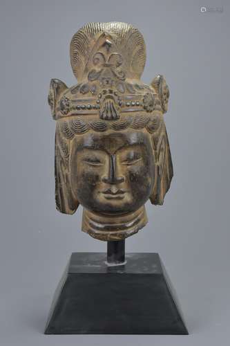 A Chinese Song / Ming Dynasty carved grey stone head of Guanyin