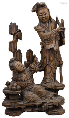 A Chinese 19th C. carved hardwood figure of two Immortals