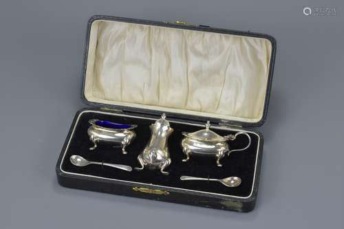 An antique English silver plated cruet set in box