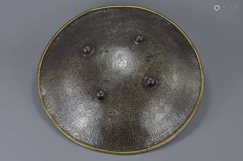 An Indo-Persian metal shield decorated with hunting scene