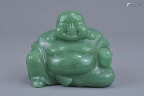 A Chinese carved green jade figure of a laughing Buddha