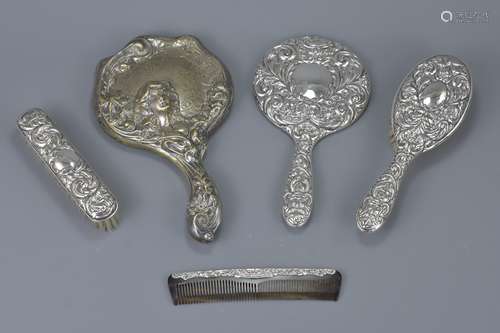 An English antique silver dressing set