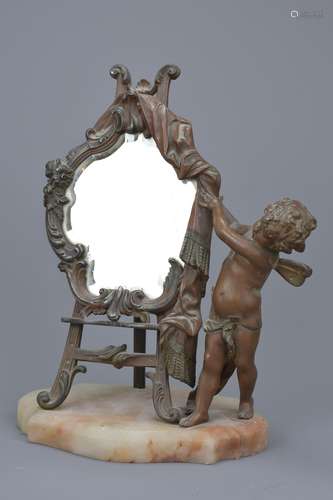 An antique French standing mirror