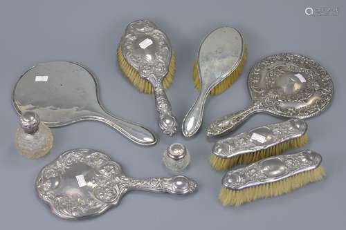 A group of antique silver hand mirrors and brushes