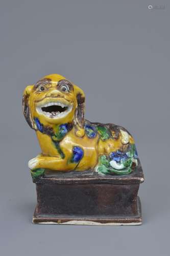 A Chinese 19/20th C. sancai biscuit porcelain figure of a Foo Dog