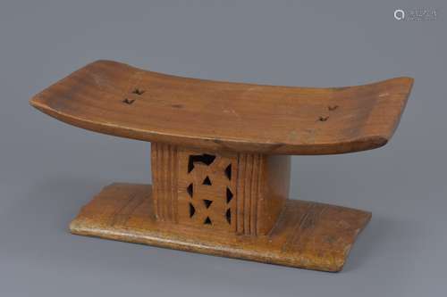 A carved wooden seat