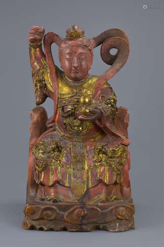 A Chinese gilt and lacquer figure of Xiwangmu