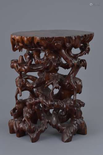 A Chinese 20th C. carved hardwood root-form display stand