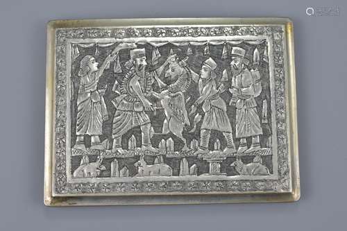 An antique Persian engraved silver cigarette case