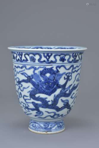 A Chinese Ming Dynasty or later blue and white porcelain dragon beaker