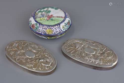 Two Chinese silver brush tops with embossed dragon decoration