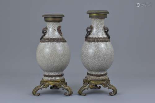 A pair of Chinese late 19th C. crackle glaze vases with metal mounts