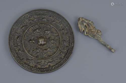 A Chinese polished bronze mirror