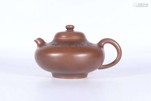 a chinese zisha tea pot with 