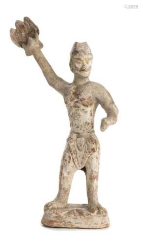 A CERAMIC FUNERARY MODEL OF A STANDING MALE FIGURE…