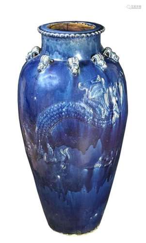A LARGE BLUE GLAZED MARTABAN CERAMIC 'DRAGON' JAR …