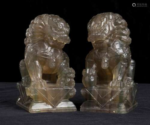A PAIR OF CARVED STONE BUDDHIST LIONS China, 20th …