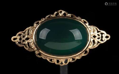 A JADEITE AND GOLD BROOCH China, 20th century The …