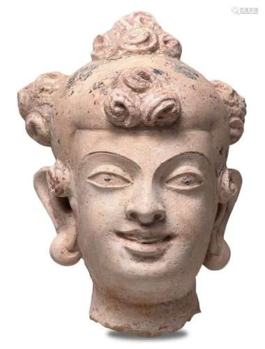 A STUCCO FEMALE HEAD Ancient region of Gandhara, 4…