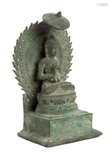 A BRONZE ENTHRONED BUDDHA Java, Majapahit style Si…