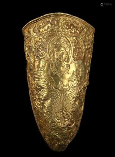 A GOLD HORN SHAPED CONTAINER WITH A DECORATION OF …