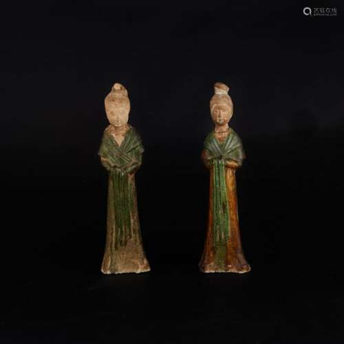 Two green and yellow enamelled terracotta statuett…