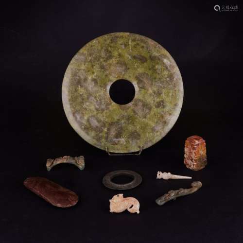 Set of 39 jade and serpentine objects in archaic s…