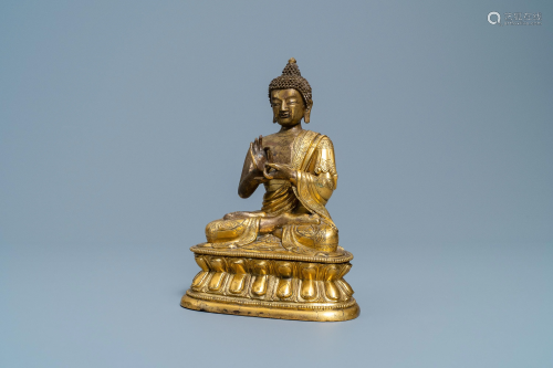 A Chinese gilt bronze figure of Buddha, 17th C.