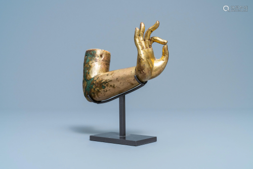 A Tibetan gilt bronze and copper alloy arm of Bud…