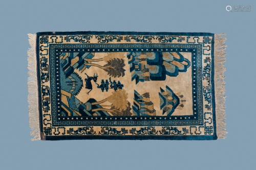 A rectangular Chinese Beijing silk carpet with a deer