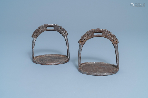 A pair of Tibetan iron stirrups with dragons, 17th C.