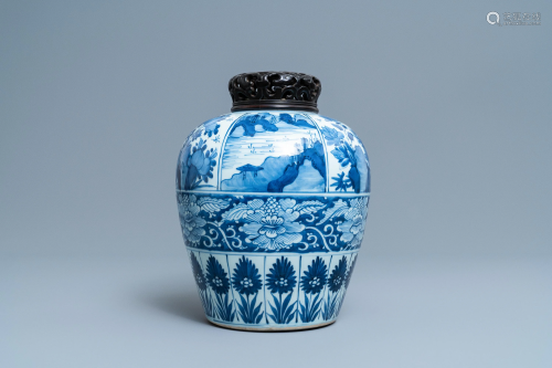 A large Chinese blue and white jar with wooden …
