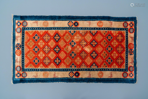 A rectangular Chinese hand-knotted wool carpet, 1…