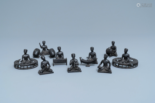A collection of bronze miniature figures of musicians,