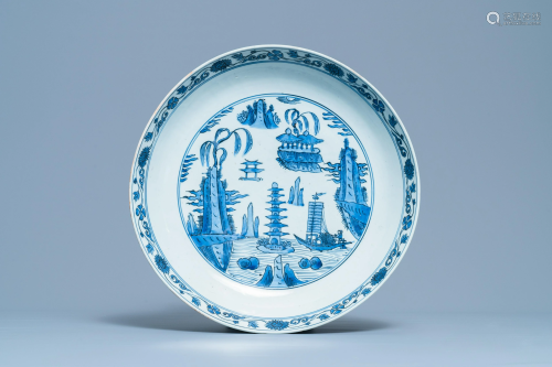 A large Chinese blue and white dish with a lands…