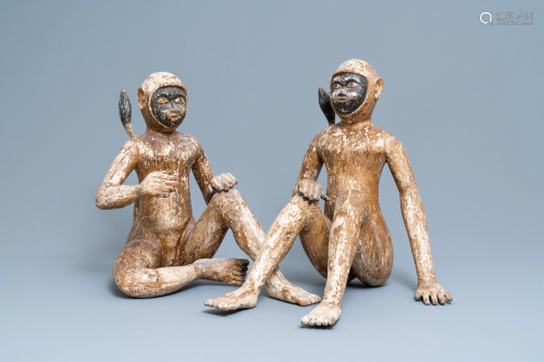 A pair of polychrome wooden figures of monkeys,