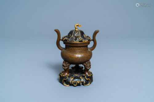 A Chinese bronze tripod censer with 'lotus leaf' cover