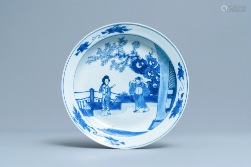 A Chinese blue and white dish with two figures i…