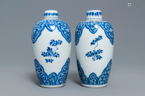 A pair of Chinese blue and white lidded jars with